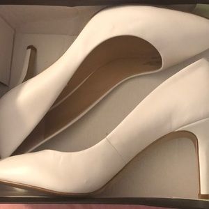 Brand new white pumps